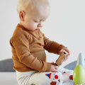 Why should babies play with wooden toys?